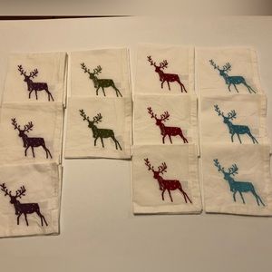 11 Cotton embroidered holiday cocktail napkins.